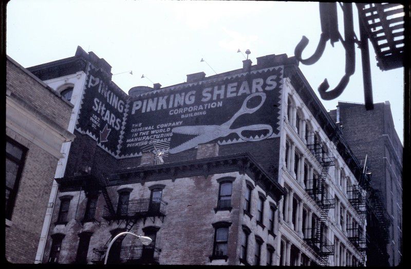 Corner of Prince and Greene Streets, with Pinking Shears sign, now Apple Store, Louis Vuitton. Late 1980s.<br/>